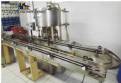 Envasadora rotativa com 12 bicos � vacuo Wada